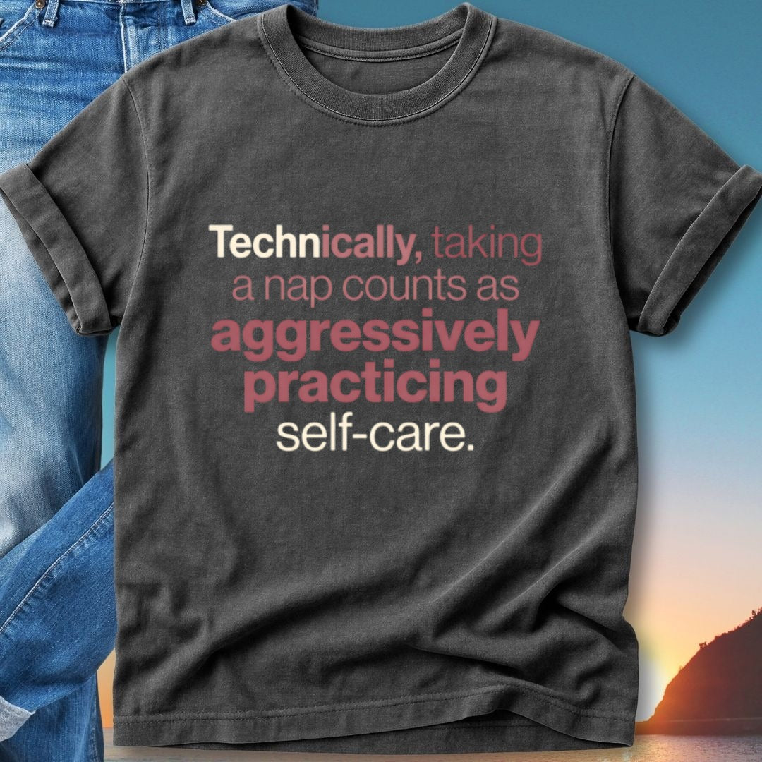Dark t-shirt with text "Technically, taking a nap counts as aggressively practicing self-care."