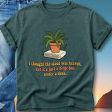 Green t-shirt with illustration and text about a beige box.