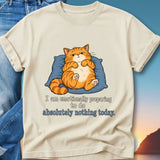 Cream t-shirt with cat resting on pillow, text "I am emotionally preparing to do absolutely nothing today."